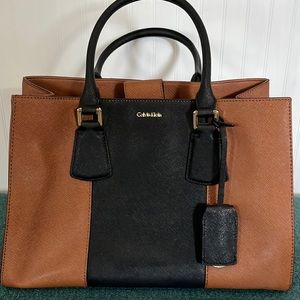 NWOT Calvin Klein two tone cognac/black handbag.